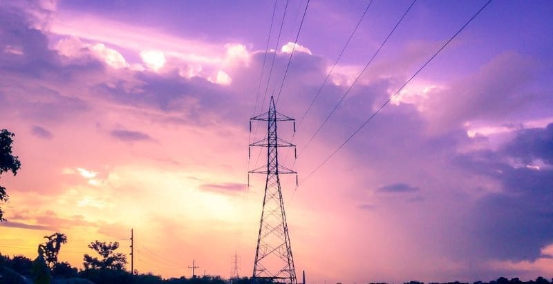 Power lines against sky, representing electromagnetic fields in modern settings.